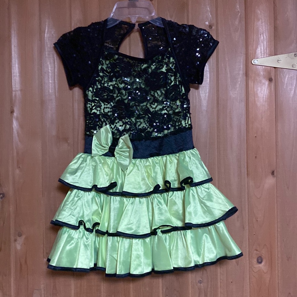 Black and lime green dance costume with matching hairpiece and choker